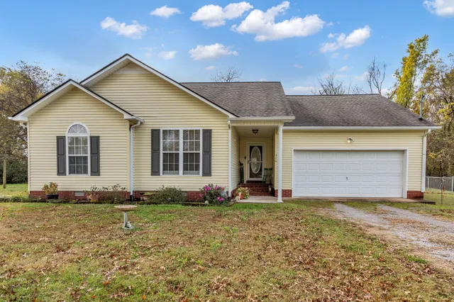 a front view of a house with yard