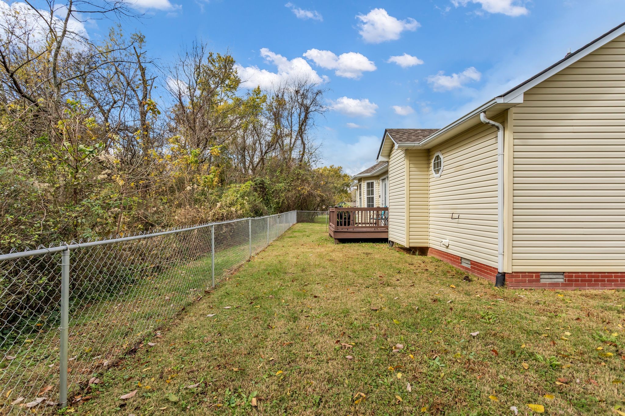 116 Jackson Street Mount Pleasant, TN 38474 - Photo 26 of 27 a view of a house with backyard