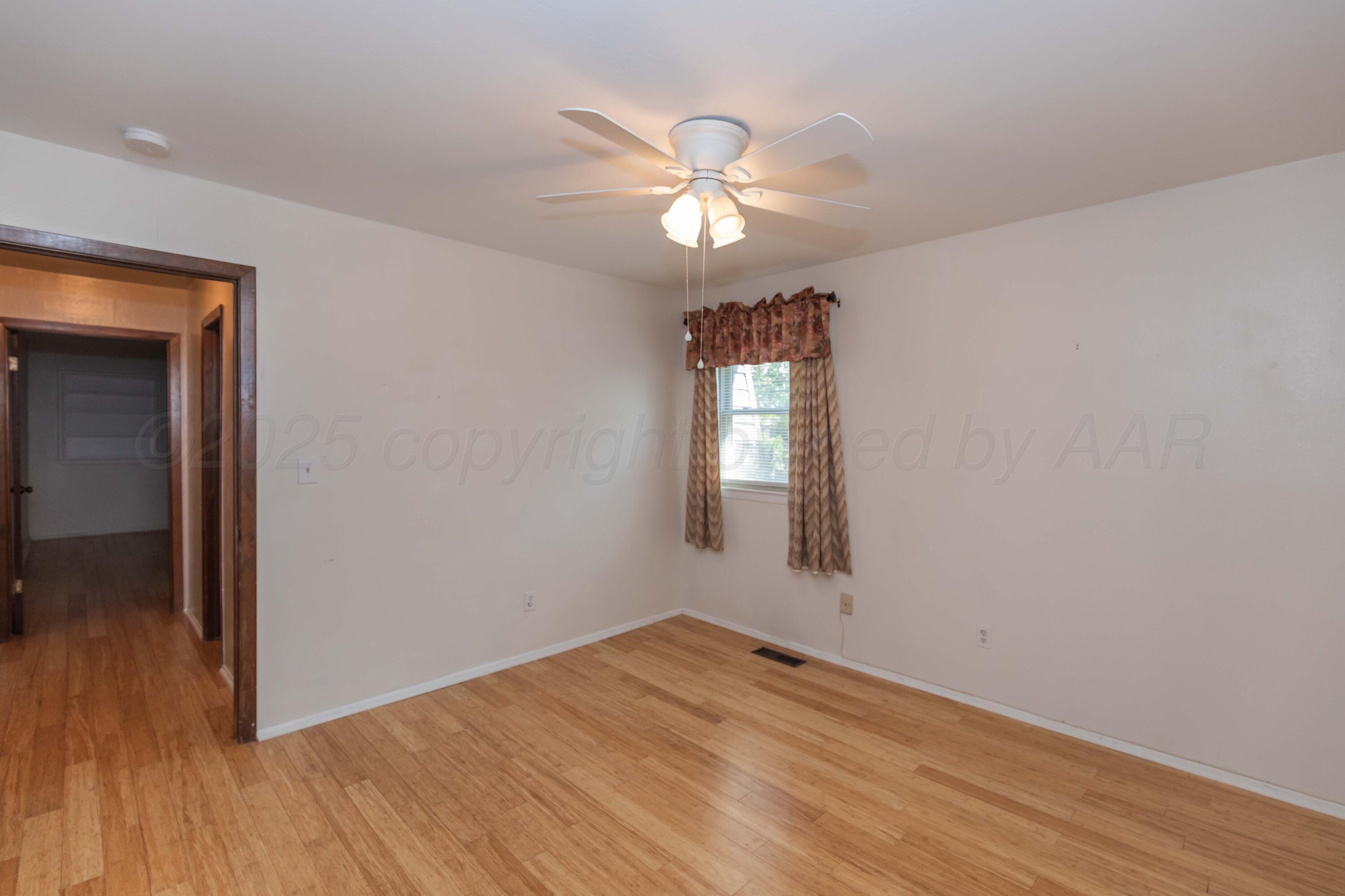7000 Sunburst Street Amarillo, TX 79110 - Photo 19 of 32 a view of empty room with wooden floor