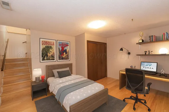 a bedroom with a bed and a desk