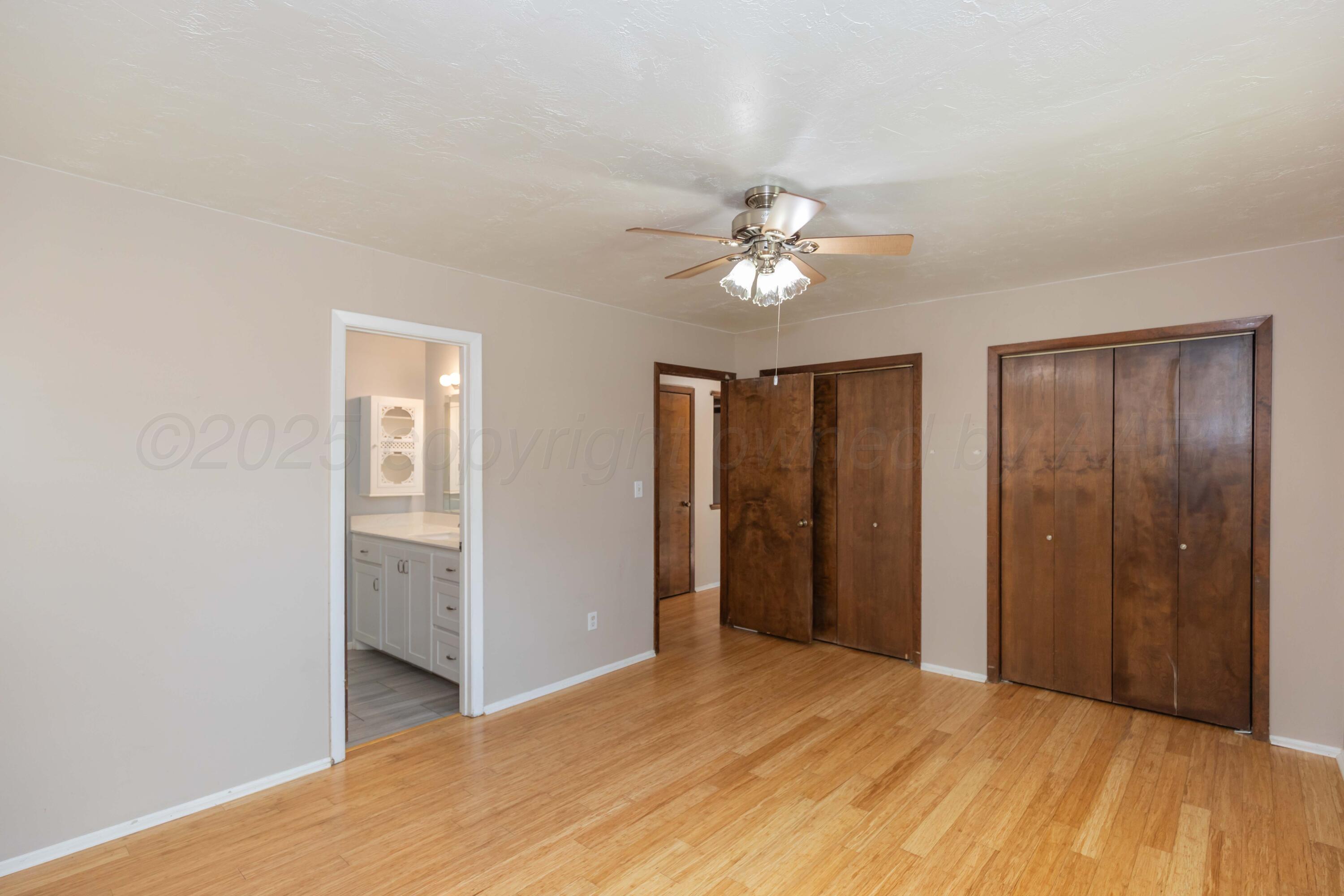 7000 Sunburst Street Amarillo, TX 79110 - Photo 10 of 32 a view of empty room with a ceiling fan