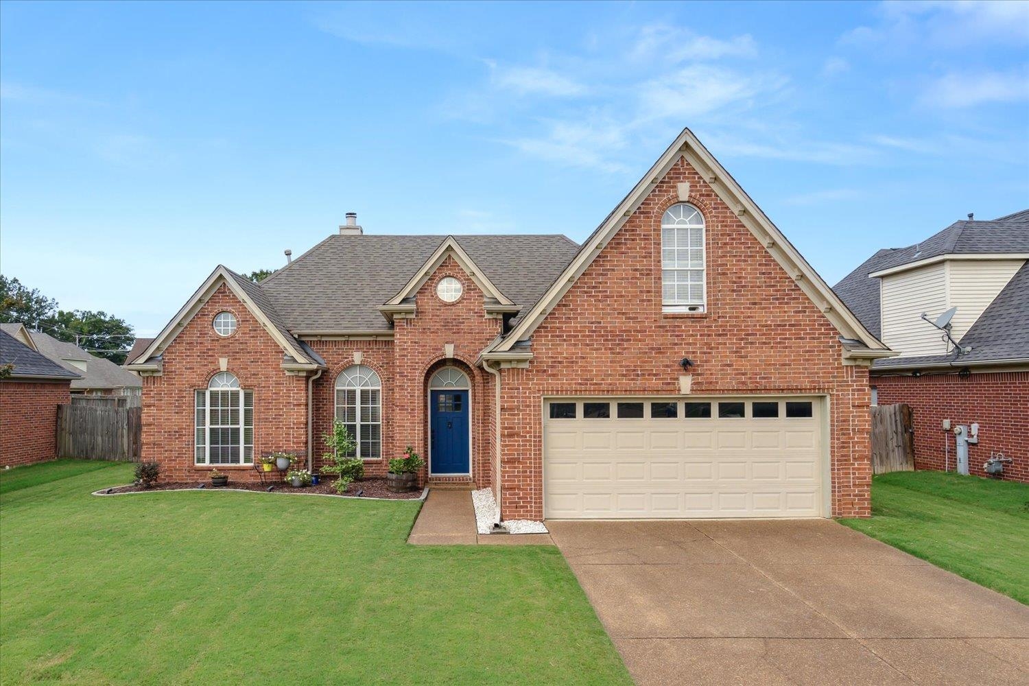 5003 Will Fall Lane Bartlett, TN 38002 - Photo 1 of 26 a front view of a house with a yard and garage