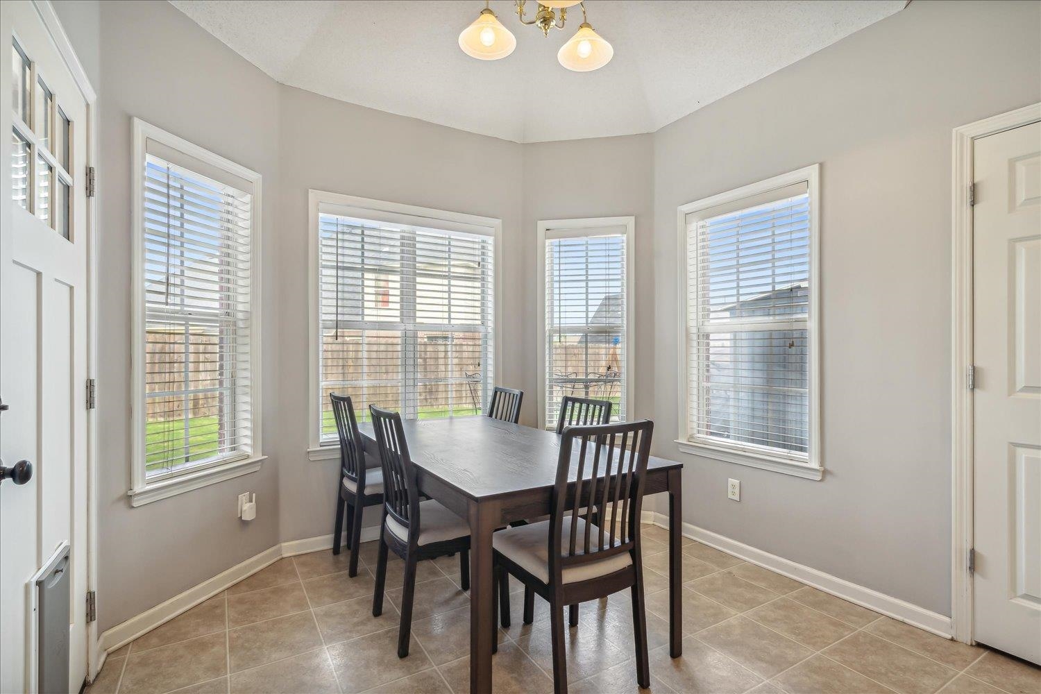 5003 Will Fall Lane Bartlett, TN 38002 - Photo 12 of 26 a view of a dining room with furniture and windows