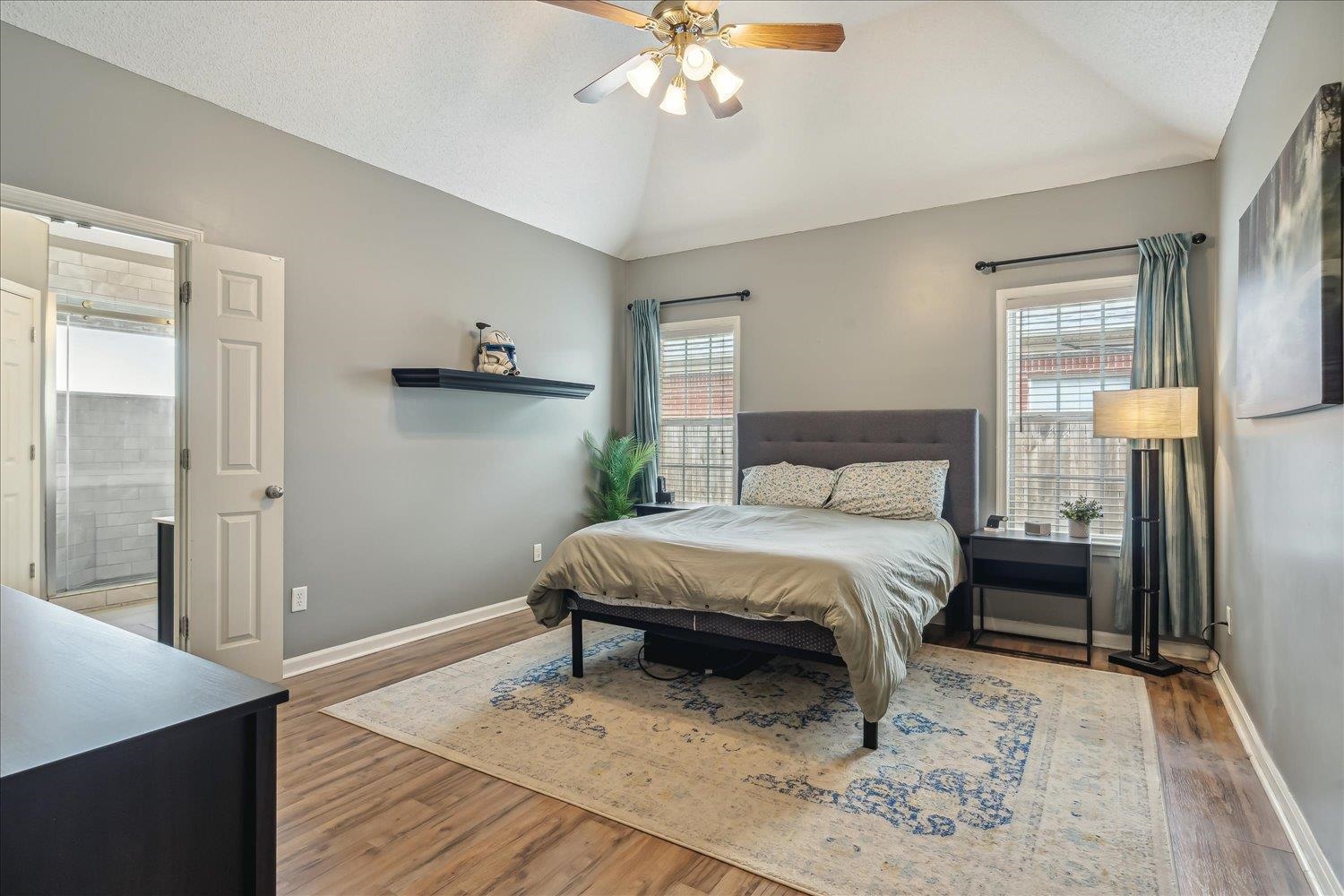 5003 Will Fall Lane Bartlett, TN 38002 - Photo 14 of 26 a spacious bedroom with a bed and a chandelier