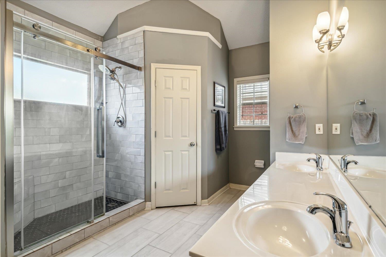 5003 Will Fall Lane Bartlett, TN 38002 - Photo 15 of 26 a bathroom with a sink and shower