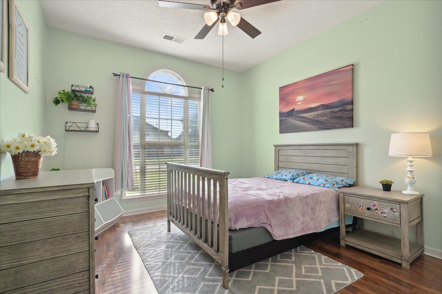 5003 Will Fall Lane Bartlett, TN 38002 - Photo 18 of 26 a bedroom with a bed and a chandelier
