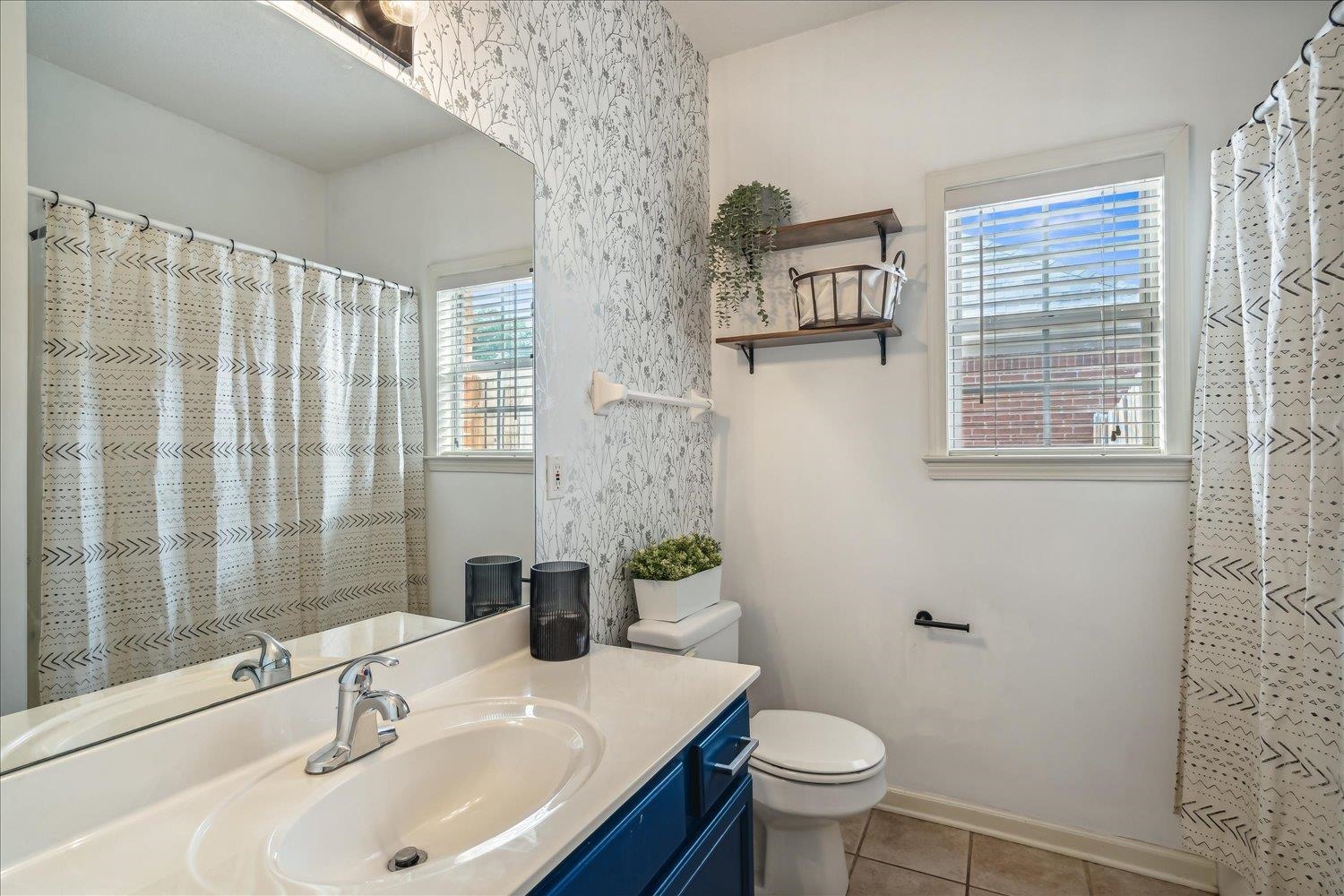 5003 Will Fall Lane Bartlett, TN 38002 - Photo 19 of 26 a bathroom with a sink toilet and window