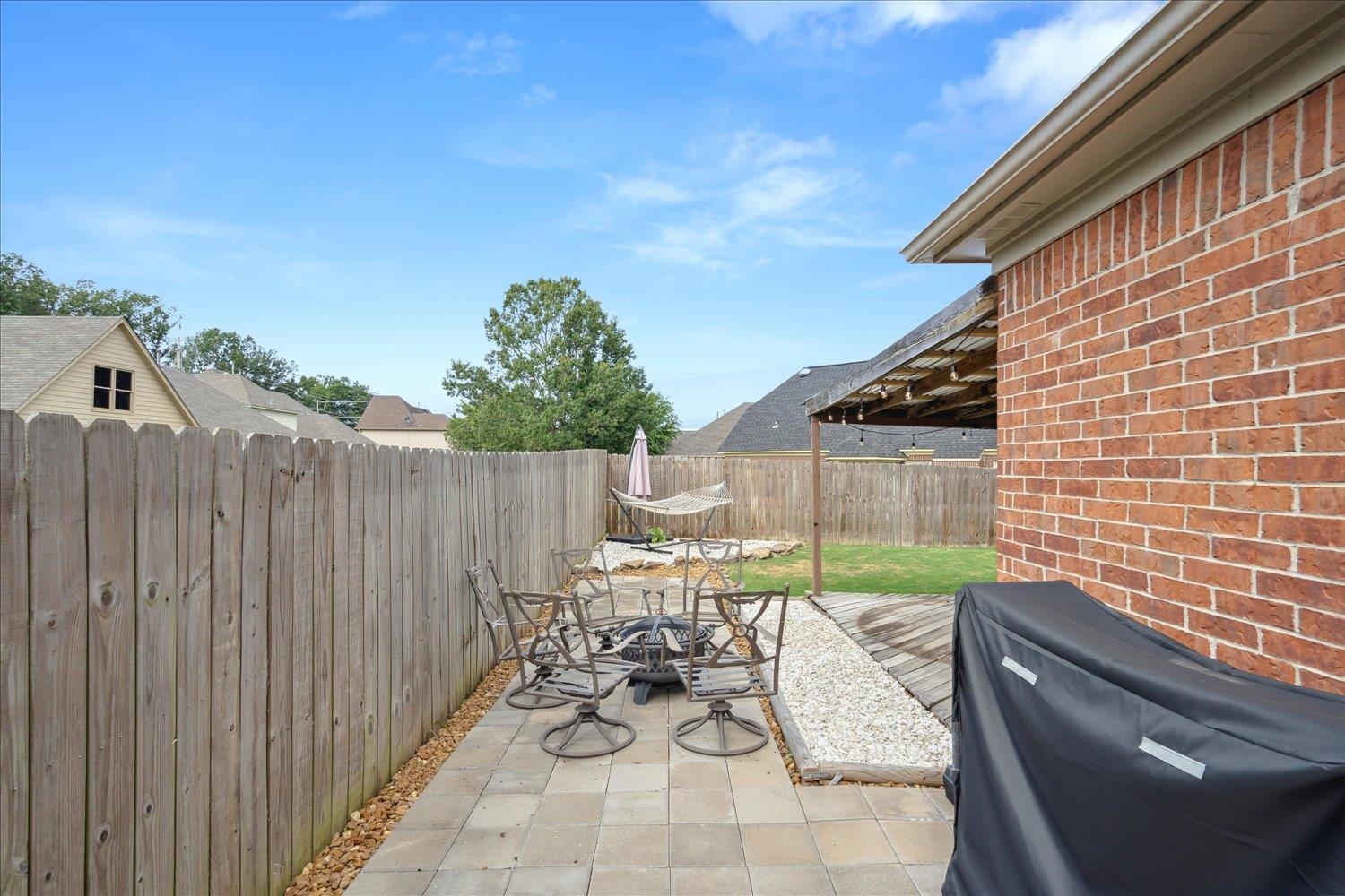 5003 Will Fall Lane Bartlett, TN 38002 - Photo 23 of 26 a view of backyard with a patio and outdoor seating