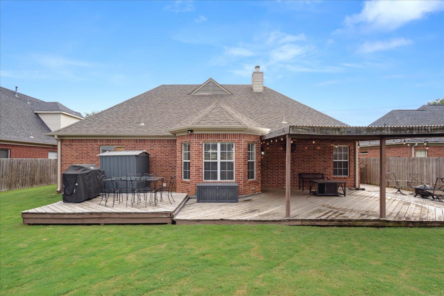 5003 Will Fall Lane Bartlett, TN 38002 - Photo 26 of 26 a front view of a house with a garden and patio