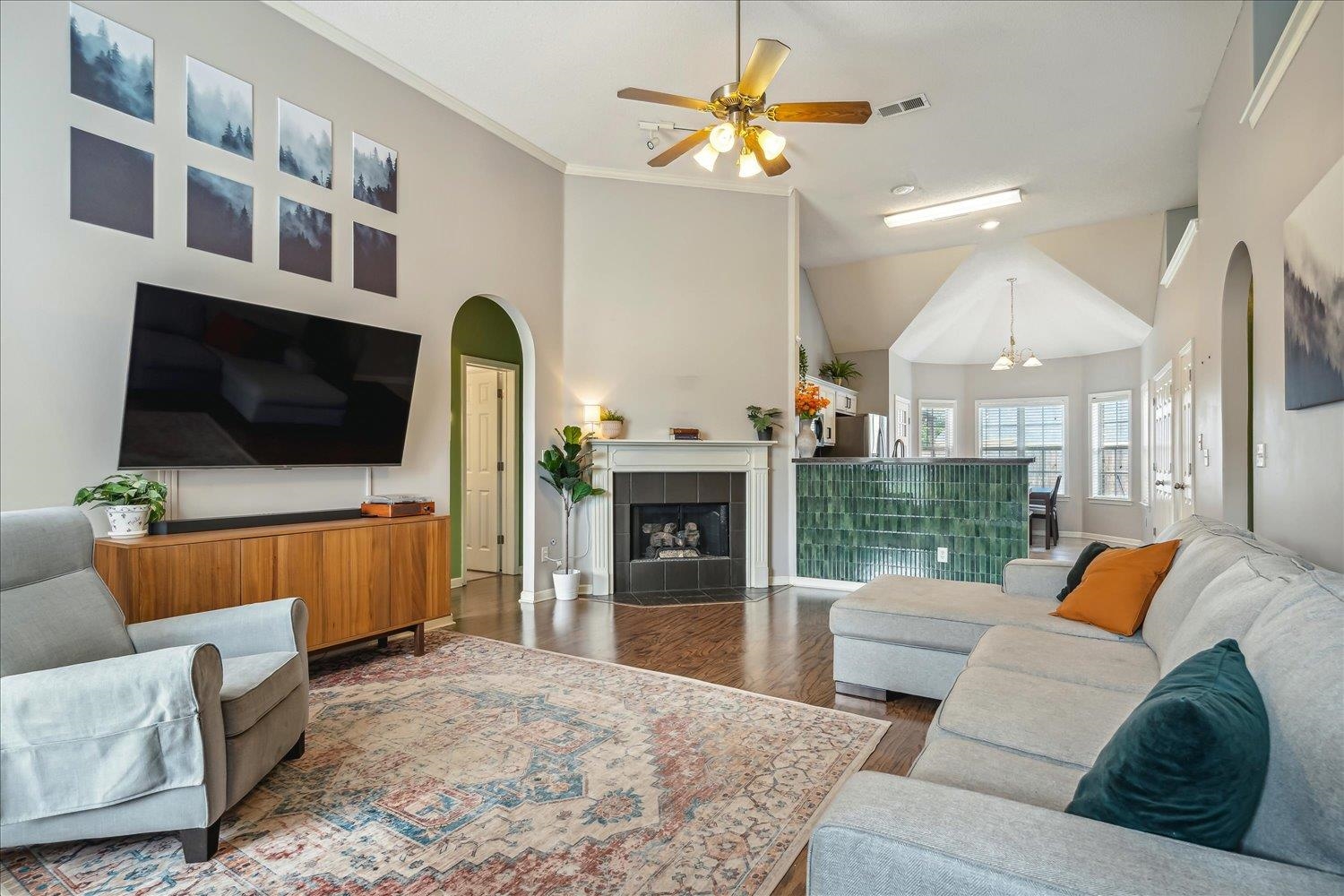5003 Will Fall Lane Bartlett, TN 38002 - Photo 6 of 26 a living room with furniture a flat screen tv and a fireplace