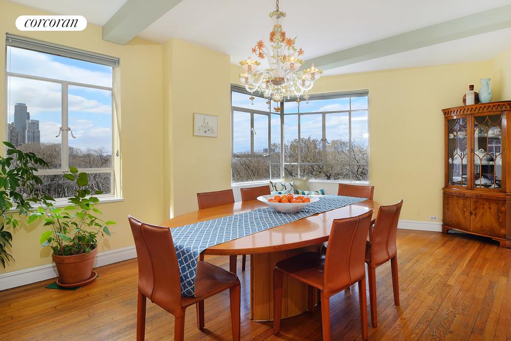 a view of a dining room with furniture wooden floor and chandelier
