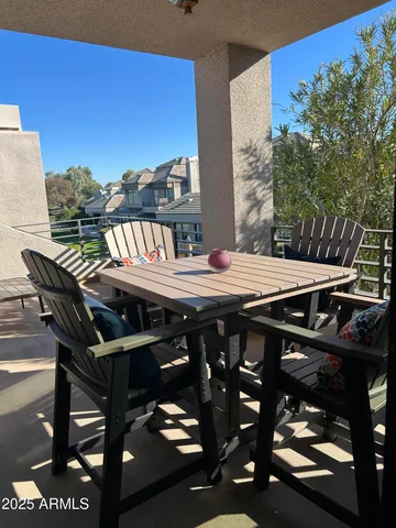 a view of a bedroom with furniture and windows