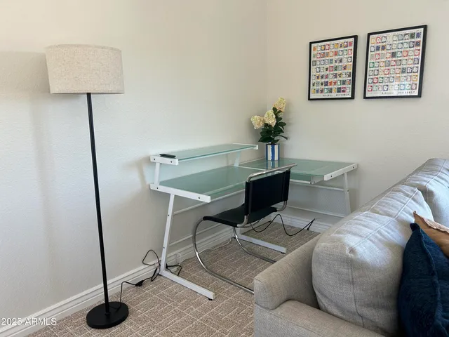 a view of a house with a yard and palm trees