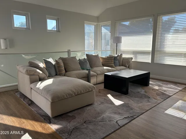 a kitchen with granite countertop white cabinets stainless steel appliances and a sink