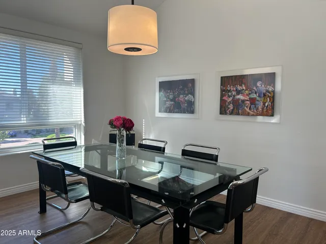 a view of a dinning table and chairs in patio