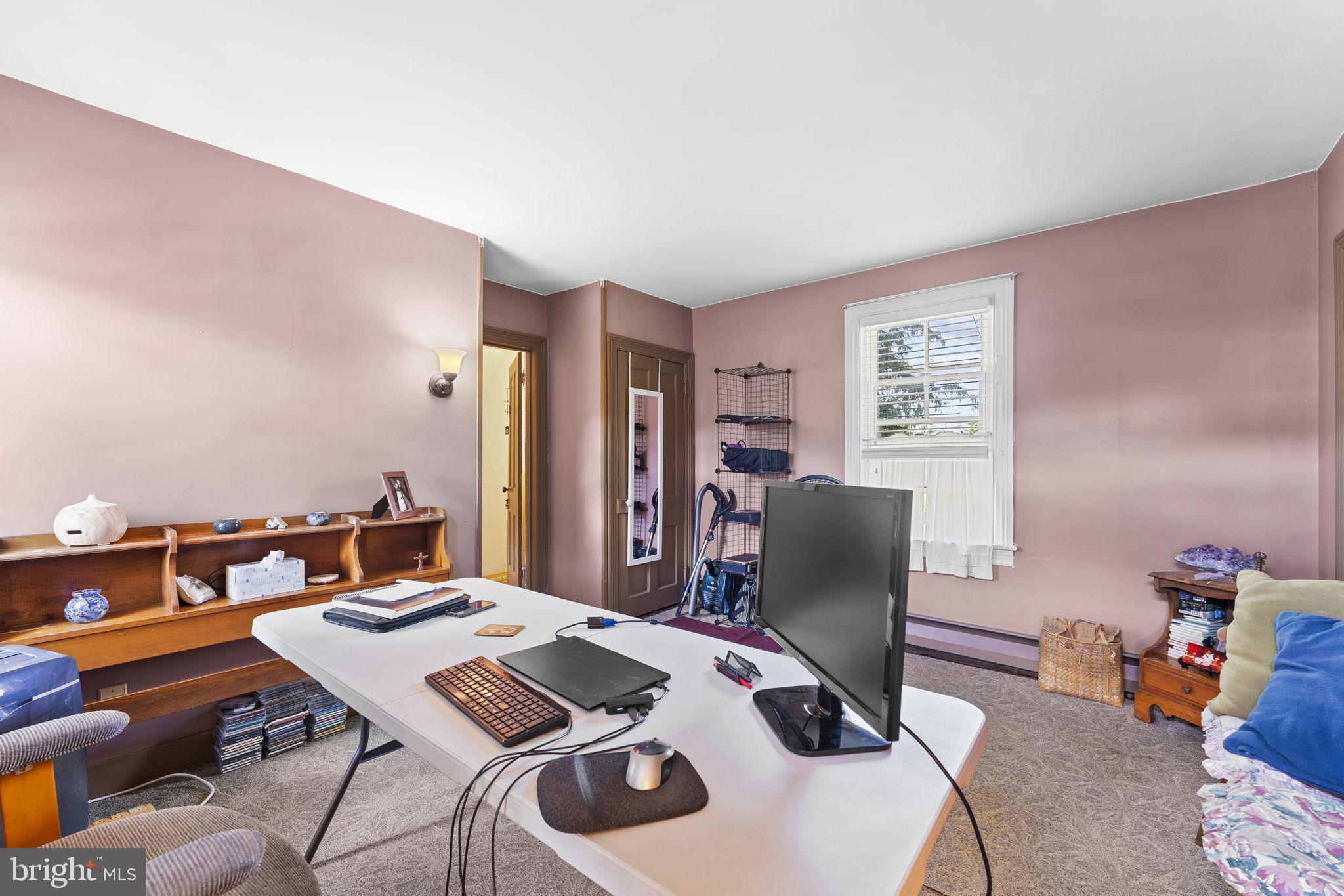 9039 Easton Road Ottsville, PA 18942 - Photo 17 of 61 a work room with furniture and wooden floor