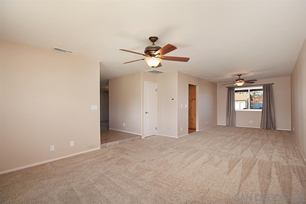 1774 Roble Grande Road Alpine, CA 91901 - Photo 15 of 25 Large living room and dining area with mountain views.