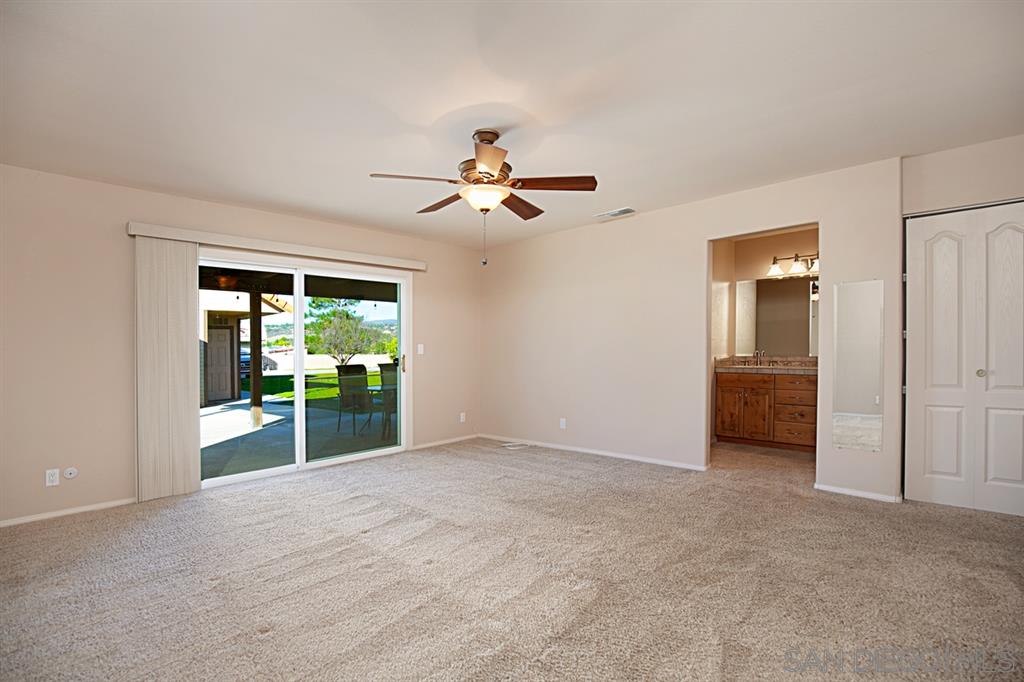 1774 Roble Grande Road Alpine, CA 91901 - Photo 17 of 25 Master Bedroom with access to covered patio, walk in closet and master bathroom with dual sinks and large vanity.