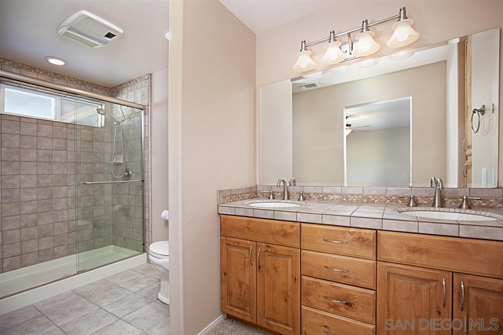 1774 Roble Grande Road Alpine, CA 91901 - Photo 18 of 25 Master bathroom with dual sinks, over sized walk in shower and large vanity.