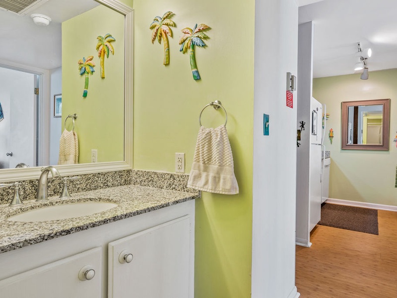 75-5870 Kahakai Road, Unit 409 Kailua-Kona, HI 96740 - Photo 5 of 16 a bathroom with a granite countertop sink and a mirror