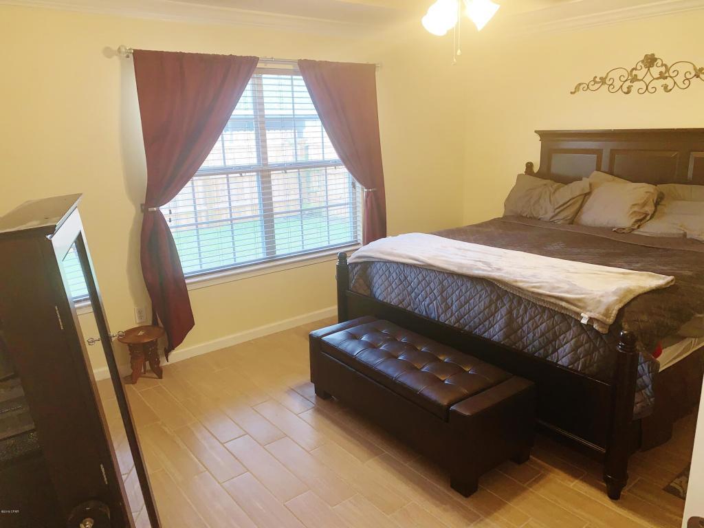2905 Cedars Crossing Panama City, FL 32405 - Photo 11 of 11 a bedroom with a bed window and tub