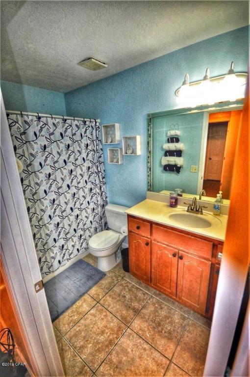 2905 Cedars Crossing Panama City, FL 32405 - Photo 5 of 11 a bathroom with a sink a toilet and shower