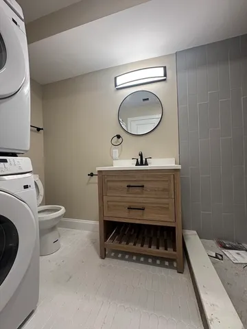 a front view of a house with a washer and dryer