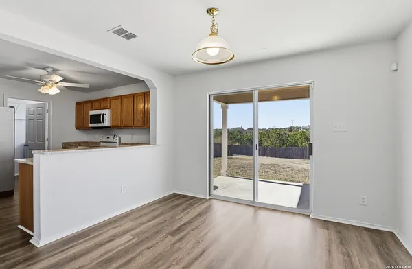 a view of an empty room with a flat screen tv