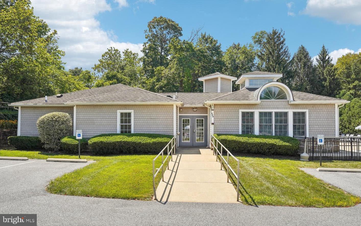 31 Ashley Court, Unit 31 Glen Mills, PA 19342 - Photo 19 of 19 a front view of a house with a yard table and chairs