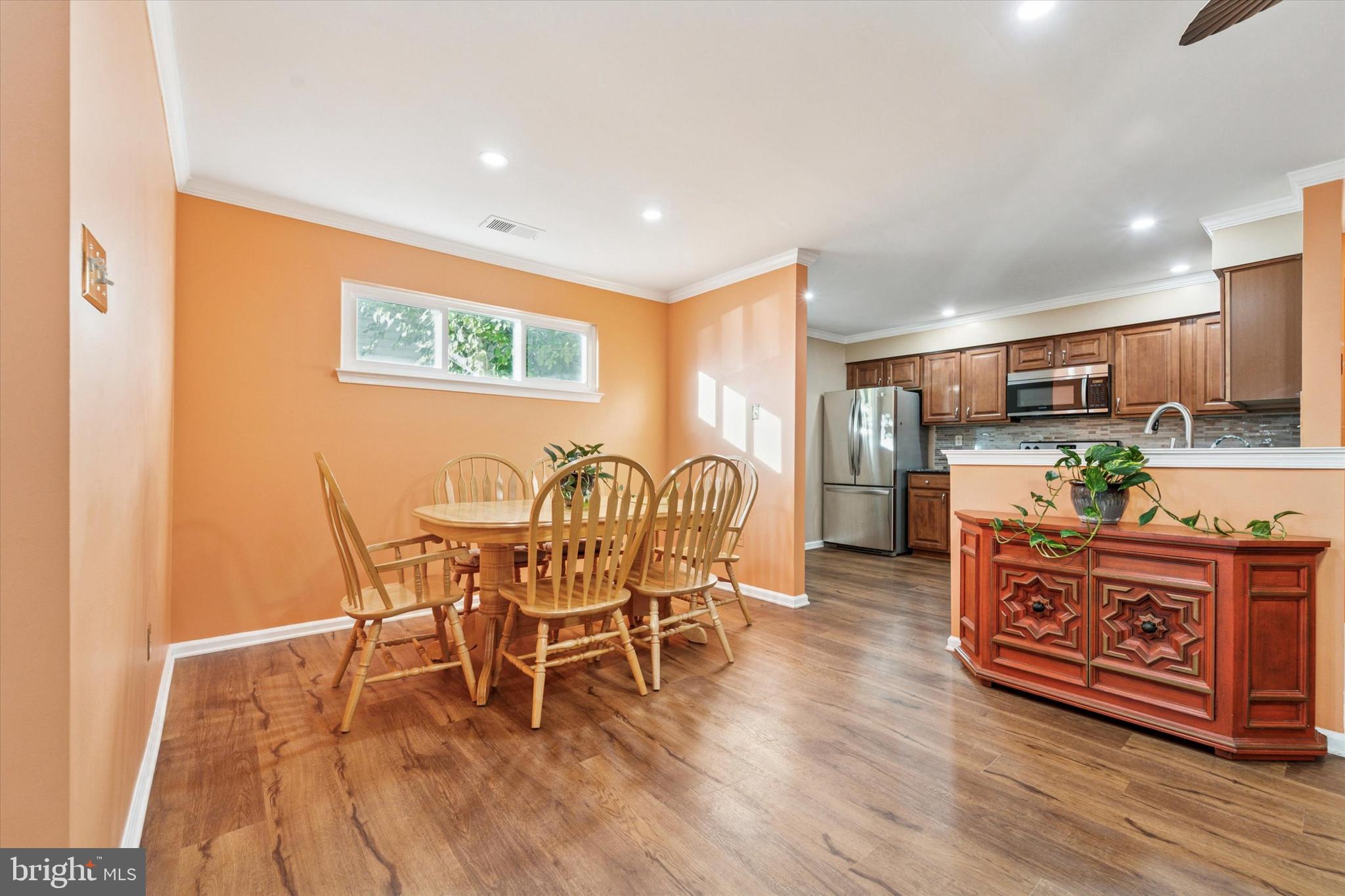 31 Ashley Court, Unit 31 Glen Mills, PA 19342 - Photo 7 of 19 a view of a dining room with furniture and wooden floor