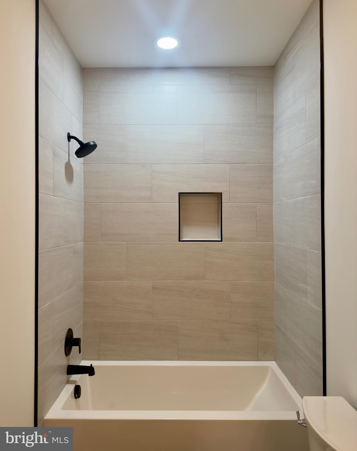 10674 Rixeyville Road Culpeper, VA 22701 - Photo 32 of 46 Hall bath - sleek tiled shower/tub surround