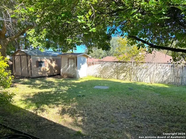 a view of yard with small cabin