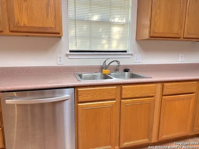 a view white cabinets and a sink