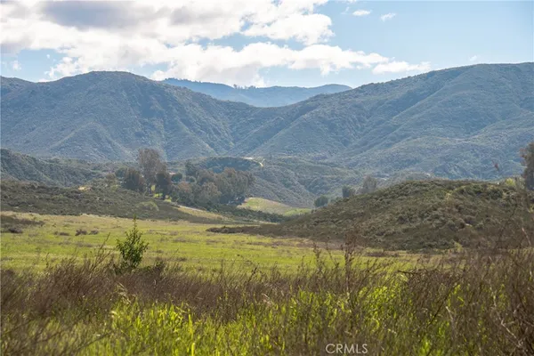 a view of an ocean and a mountain