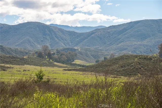 a view of an ocean and a mountain