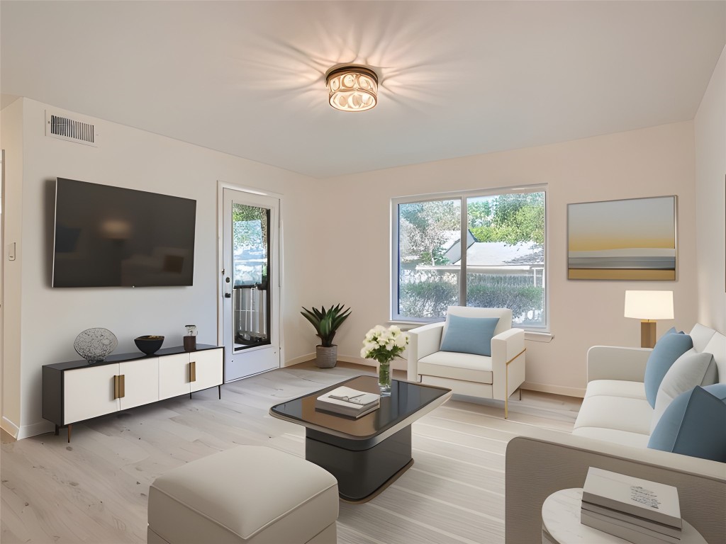 8210 Bent Tree Road, Unit 157 Austin, TX 78759 - Photo 1 of 1 a living room with furniture and a flat screen tv