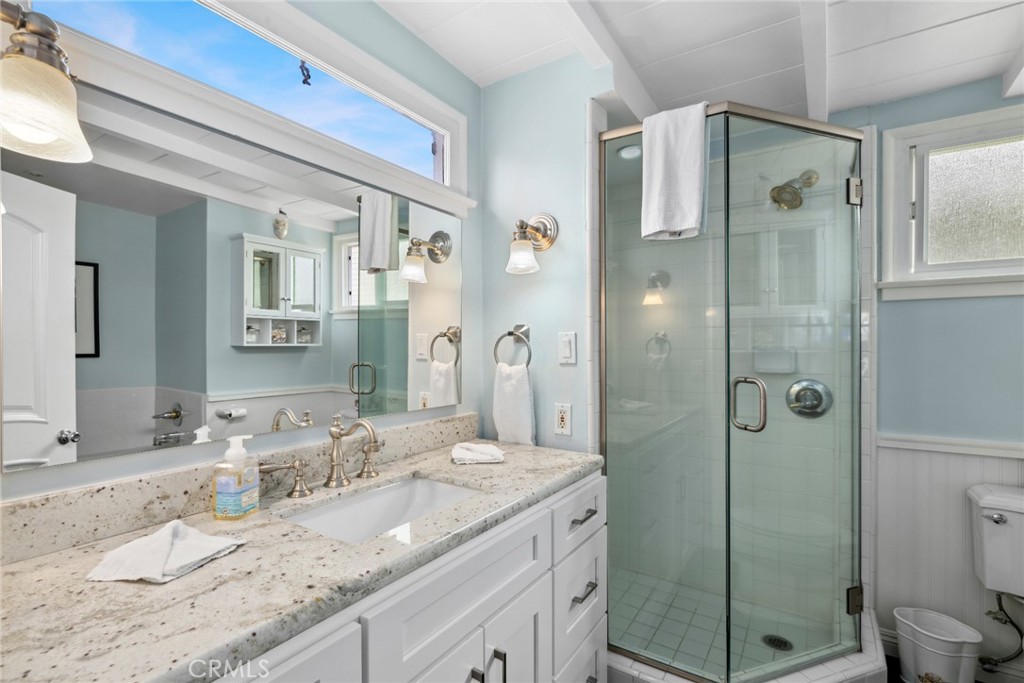 112 Abalone Avenue Newport Beach, CA 92662 - Photo 14 of 25 a bathroom with a granite countertop sink shower mirror and toilet