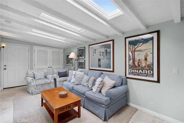 a living room with furniture and a rug