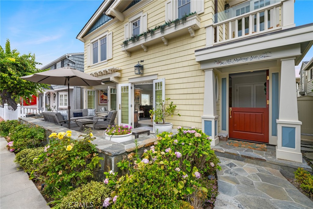 112 Abalone Avenue Newport Beach, CA 92662 - Photo 4 of 25 a view of a house with sitting area and garden
