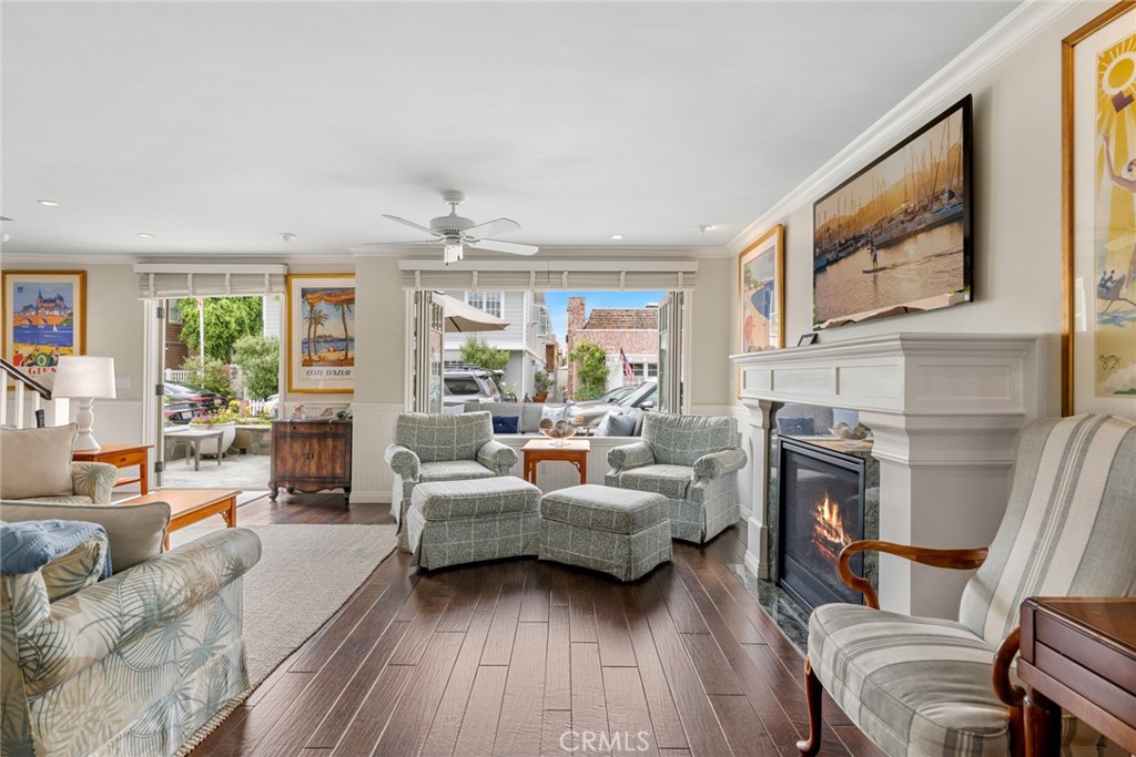 112 Abalone Avenue Newport Beach, CA 92662 - Photo 6 of 25 a living room with furniture and a fireplace