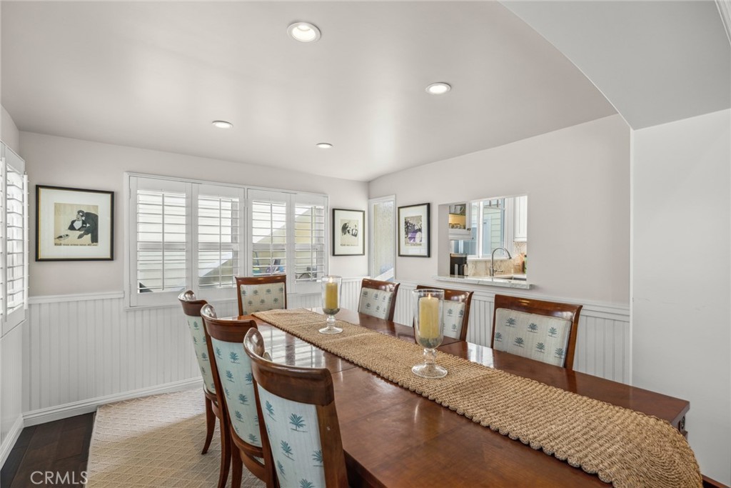 112 Abalone Avenue Newport Beach, CA 92662 - Photo 9 of 25 a view of a dining room with furniture and a window