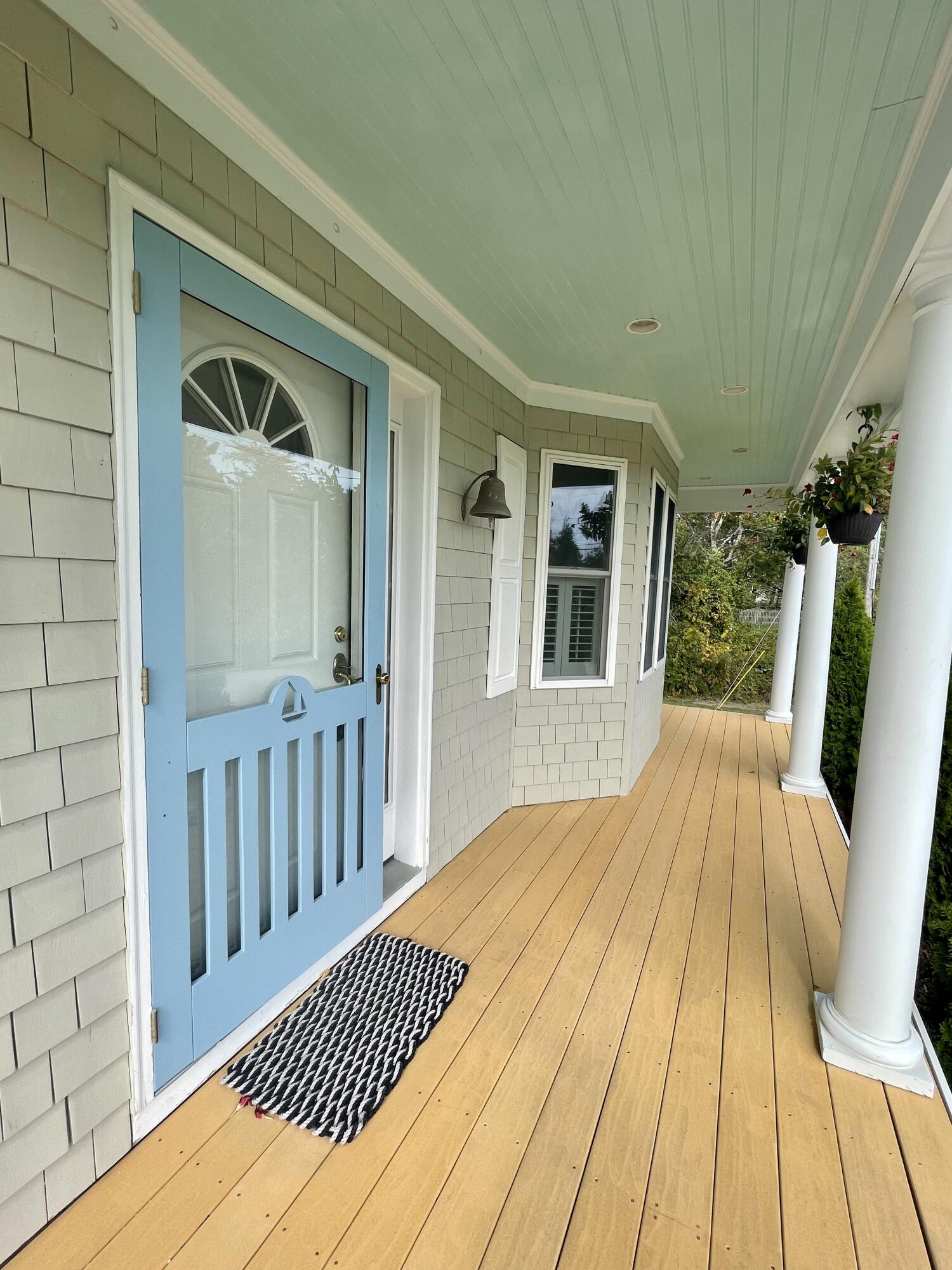 215 Harbor Point Road Barnstable, MA 02675 - Photo 2 of 10 a view of backyard with wooden floor and fence