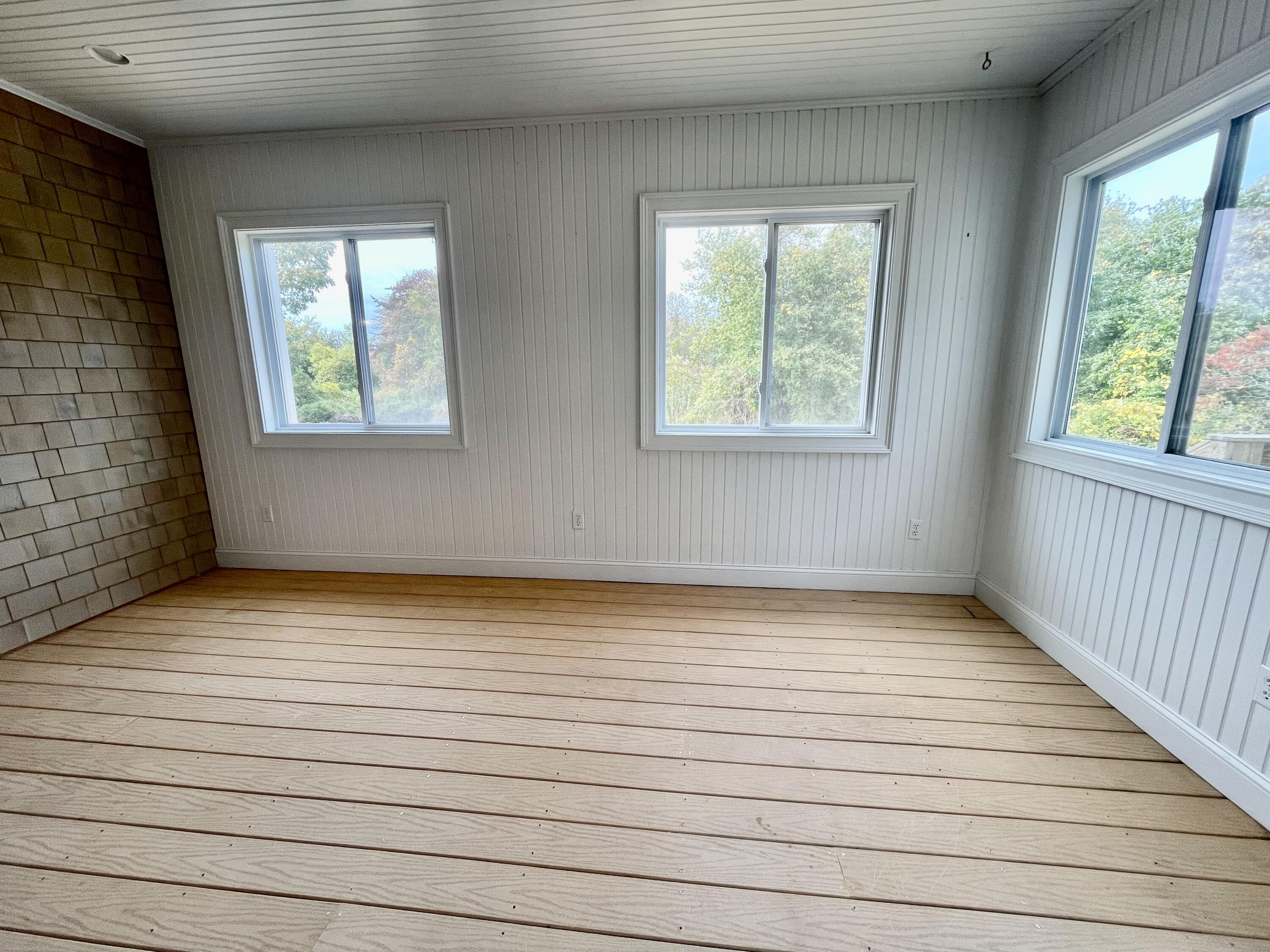 215 Harbor Point Road Barnstable, MA 02675 - Photo 6 of 10 a view of an empty room with wooden floor and a window