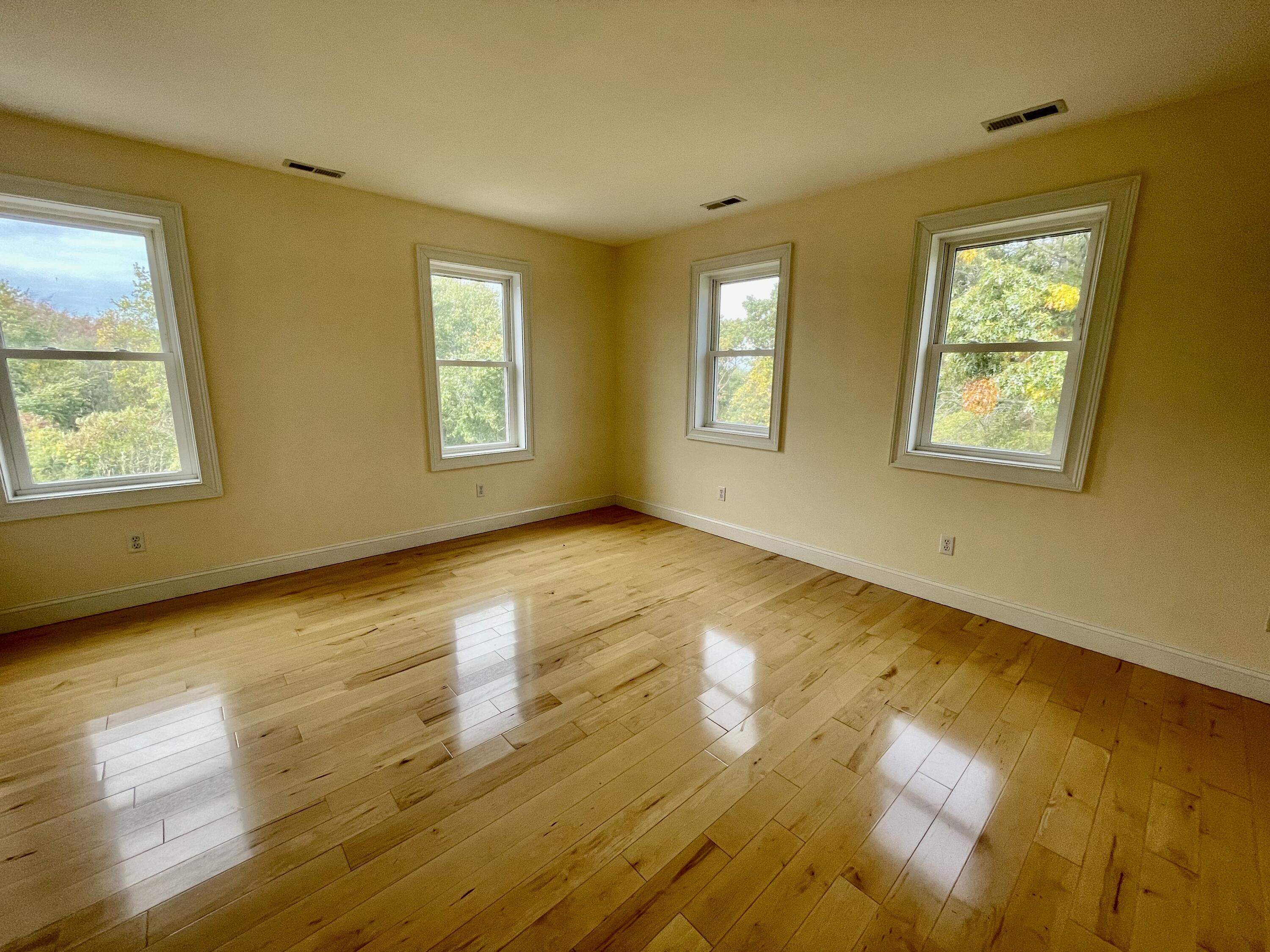 215 Harbor Point Road Barnstable, MA 02675 - Photo 9 of 10 a view of an empty room with wooden floor and a window