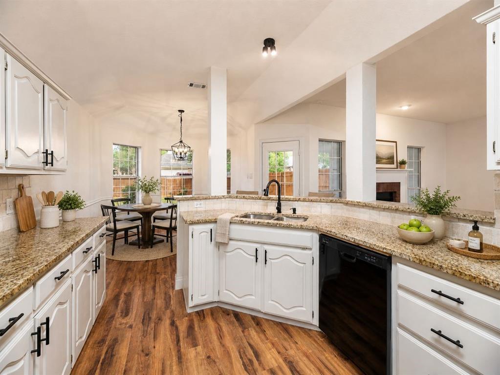 215 Barbara Way Red Oak, TX 75154 - Photo 11 of 36 Kitchen (virtually-staged) opens toward the dining and living areas, keeping daily routines simple and making it easier to stay connected while preparing meals.