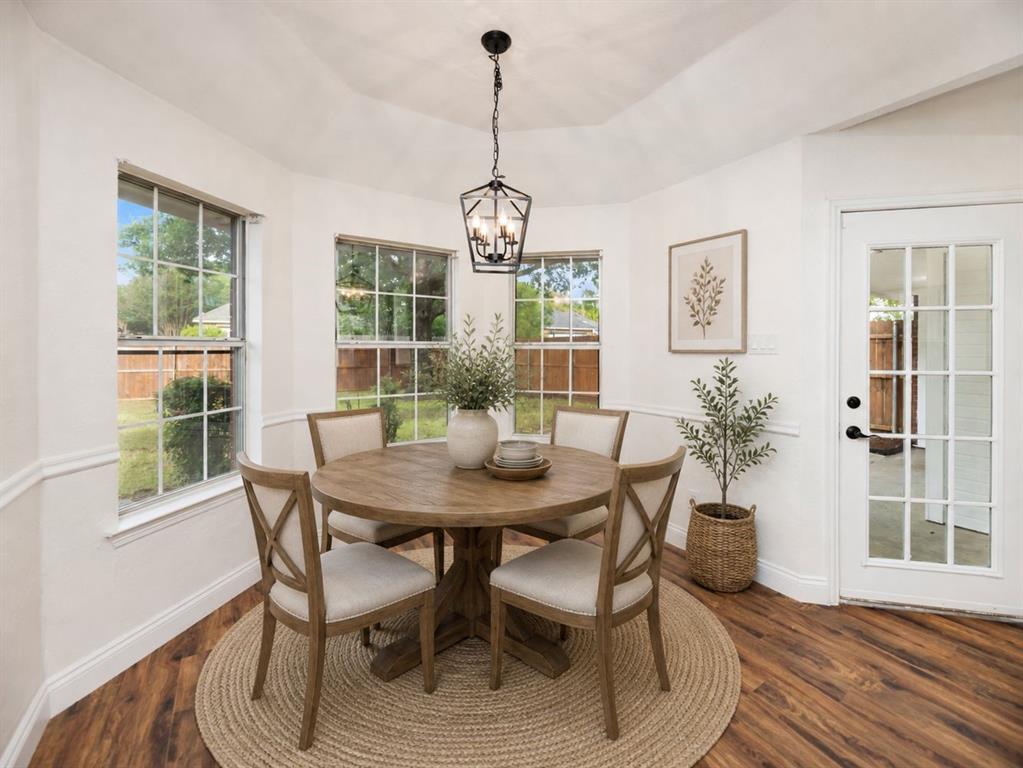 215 Barbara Way Red Oak, TX 75154 - Photo 13 of 36 Virtually staged dining nook shows a cheerful place for meals, homework, coffee, or casual conversation overlooking the yard.