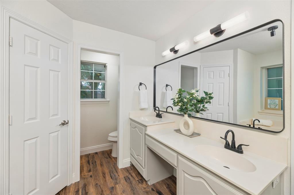 215 Barbara Way Red Oak, TX 75154 - Photo 18 of 36 Primary bath features a wide vanity, offering everyday convenience with room for all your morning and evening routine. Dual Walk-In Closets