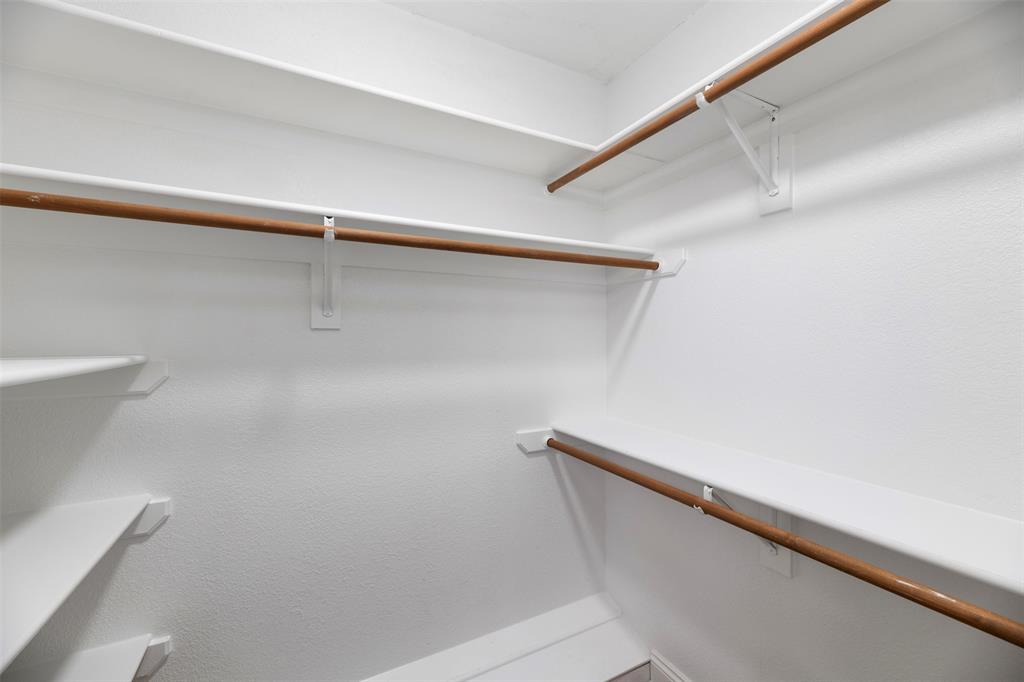 215 Barbara Way Red Oak, TX 75154 - Photo 21 of 36 Dual walk-in closets with built-in shelving — practical storage already in place, giving the next owner room to organize clothing, shoes, and seasonal items with ease.