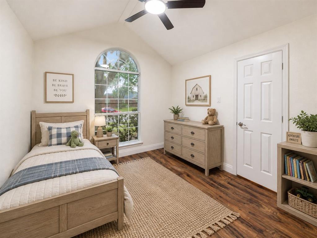 215 Barbara Way Red Oak, TX 75154 - Photo 22 of 36 Virtually staged bedroom showing the home’s potential — the arched window adds charm and natural light, while the room offers space for a restful bedroom setup.