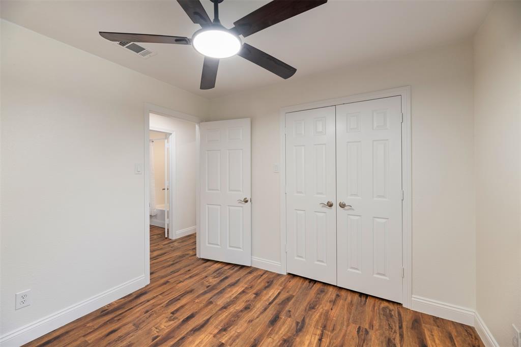 215 Barbara Way Red Oak, TX 75154 - Photo 26 of 36 The 3rd bedroom has double-door closet — a functional layout that offers good storage and everyday comfort.